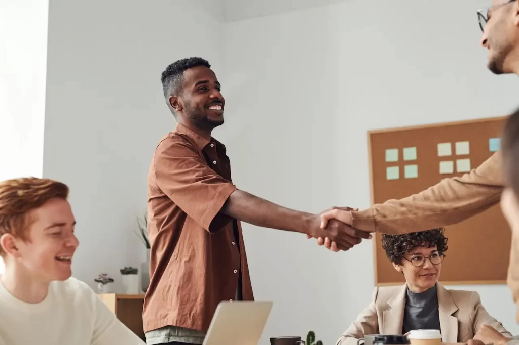 Black professional engaging in a handshake symbolizing BEE strategic advantage collaboration